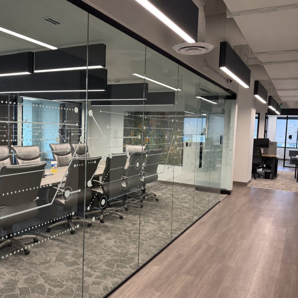Frameless glass conference room front with decorative graphic film, Dallas office finish-out by Gibraltar Glass
