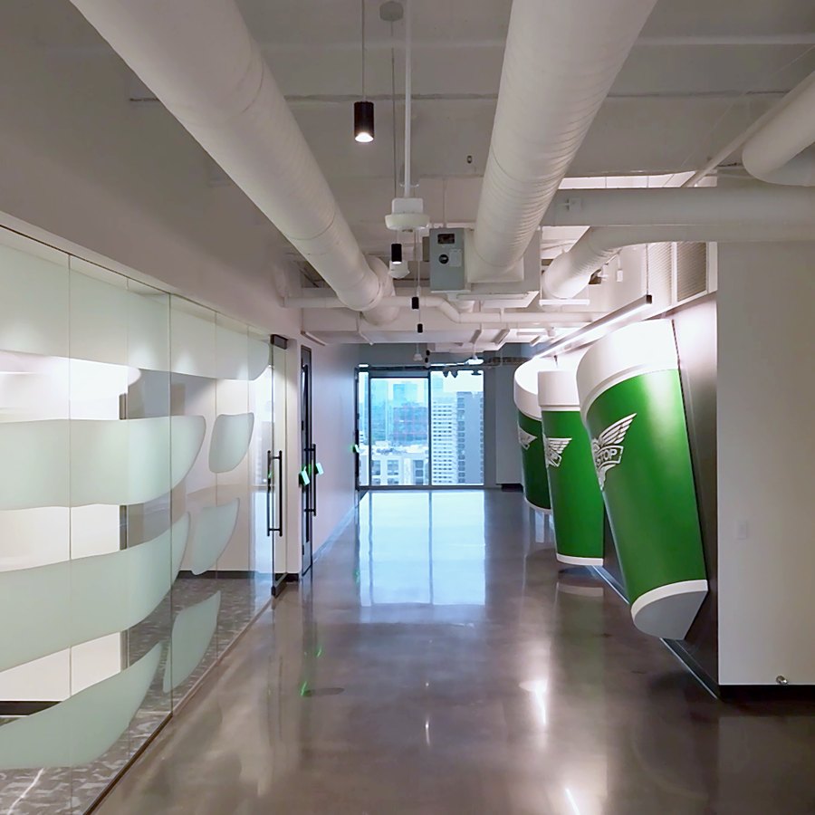 Full-floor corridor of interior glass office fronts, Dallas spec suite finish-out by Gibraltar Glass